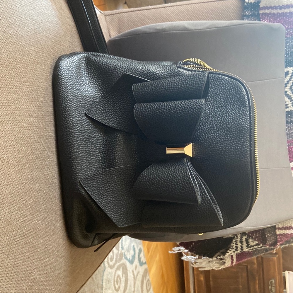 Gently used really cute backpack. It’s too small for me. But I loved it